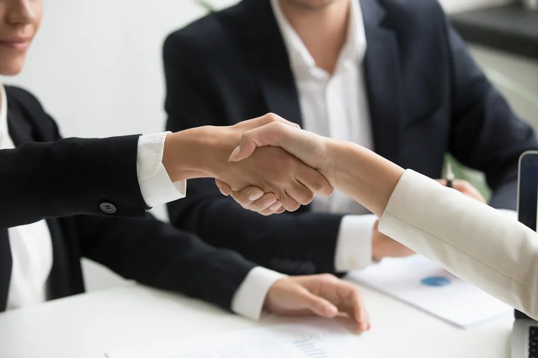 korean office workers handshake